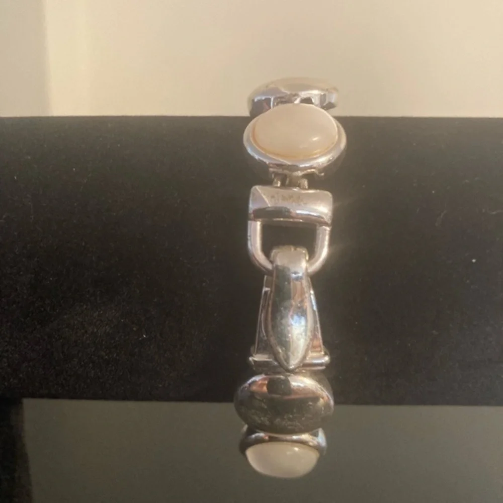 Silver tone and cream/white opalescent accents